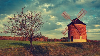 Beautiful old windmill. Landscape photo with architecture at sunset (golden hour). Chvalkovice - Czech Republic - Europe.