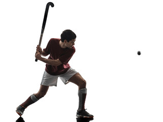 Naklejka premium one caucasian field hockey player man isolated silhouette on white background