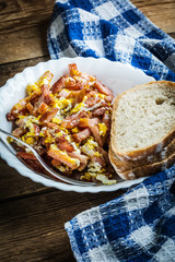 Pieces of sausage fried with egg.