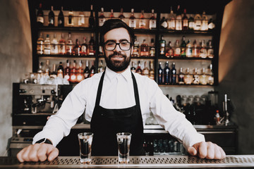 Chin-chin. Barman with Beard. Prepared Cocktail.