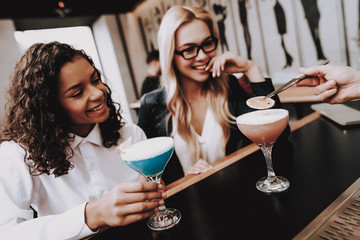 Chin-chin. Beard. Barman. Girls. Cocktails. Sit.