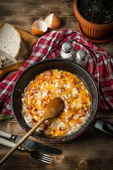 Scrambled eggs with sausage.