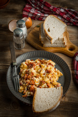 Scrambled eggs with sausage.