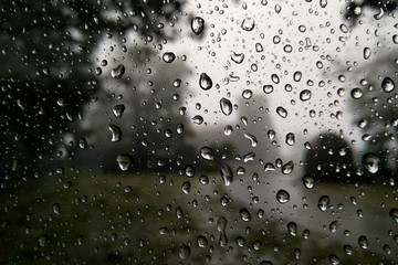 Raindrops on a window to the countryside