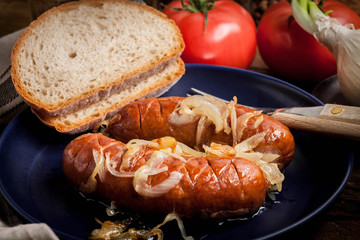 Fried sausage with onions.