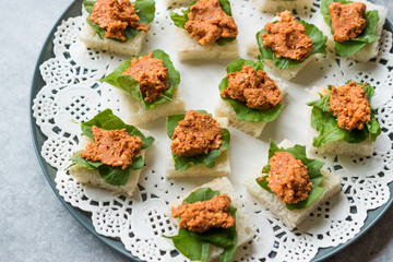 Canape with Muhammara, Adjika, Ajika or Acuka on Small Square Breads with Round Plate.
