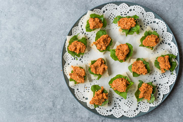 Canape with Muhammara, Adjika, Ajika or Acuka on Small Square Breads with Round Plate.
