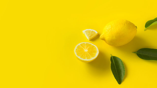 Top view of lemon and leaves on yellow background.concepts ideas of fruit,vegetable