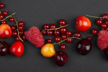 different ripe fruits on a black background