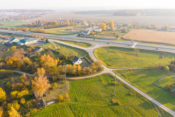 Fototapeta na wymiar Autumn aerial landscape. Twistling roads in the countryside
