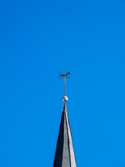 Weather vane in the shape of a donkey on the spire of the old Church of St. Lawrence in Diekirch,...