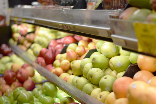 Fresh organic fruits and produce on a supermarket shelf