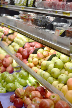 Fresh organic fruits and produce on a supermarket shelf