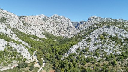 Fototapeta na wymiar The Velika Paklenica karst river canyon is within national park, Velebit, Croatia. It is famous for hiking and free climbing on huge rock faces. 