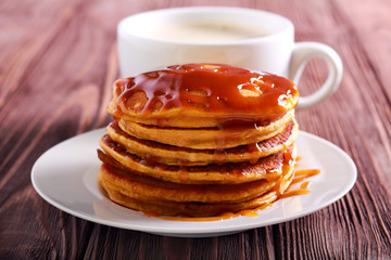 Pumpkin pancakes stack with caramel sauce