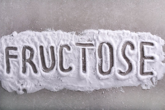 Fructose word written in fructose powder