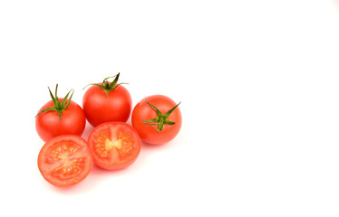 Fresh cherry tomatoes on white background with space for text.