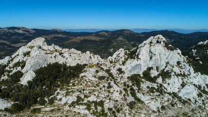Fototapeta na wymiar Dabarski Kukovi on Velebit close do Karlobag, Croatia, are a ridge composed of steep peaks, which are unique geologic formation. They are famous for hiking and free climbing on huge rock faces. 