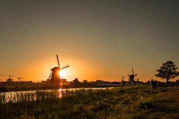 Kinderdijk windmills at sunset  - 228893394