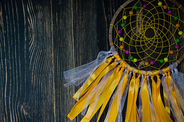 Handmade dreamcatcher on wooden background