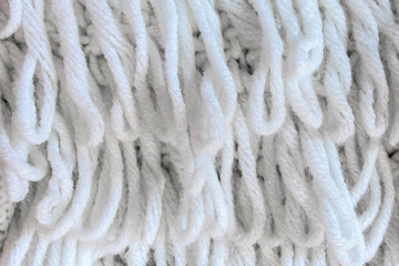 White knitting fabric texture background or knitted pattern background. Knitting or knitted background close up view.