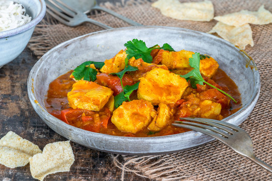 Fish Mappas - Kerala style coconut fish curry with rice. It's a popular dish in southern Indian state of Kerala.