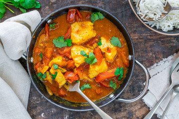Fish Mappas - Kerala style coconut fish curry with rice. It's a popular dish in southern Indian state of Kerala. Top view