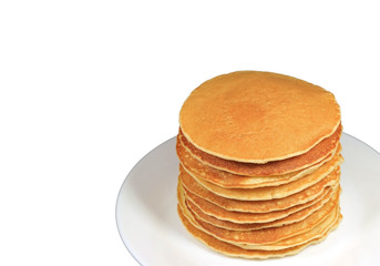 Stack of homemade plain pancakes served on white plate isolated on white background with free space for text and design 