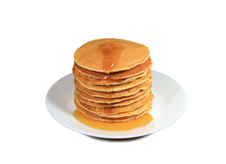 Stack of fresh made pancakes with maple syrup served on white plate isolated on white background with free space for text and design