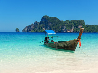 Fototapeta na wymiar Longtail boat anchored at Ao Yongkasem beach on Phi Phi Don Island, Krabi Province, Thailand