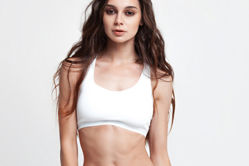 Fototapeta na wymiar Sexy young woman in underwear on white background