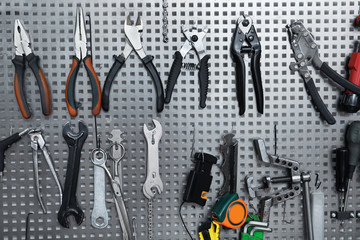 Set of different tools for bicycle repairing on stand