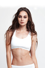 Fototapeta premium Sexy young woman in underwear on white background