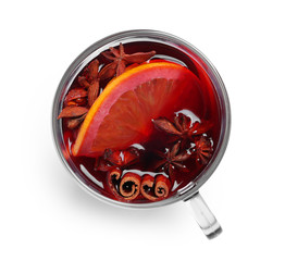 Cup with red mulled wine on white background, top view