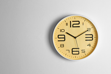 Stylish clock and space for text on light background. Time management