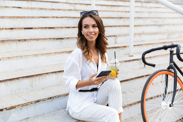 Attractive young woman spending time at the park