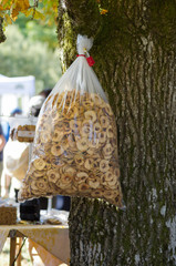 Bag of dried apple chips hanging from tree