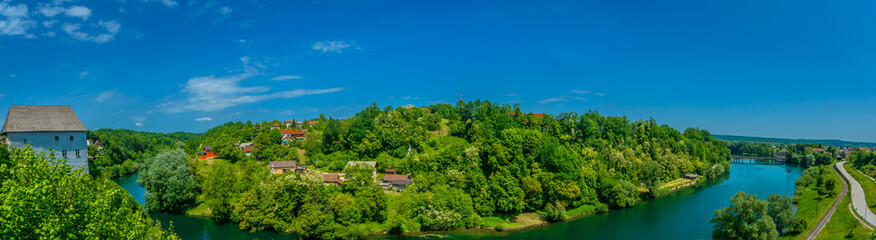 Fototapeta na wymiar River Kupa panorama landscape. / Panorama of colorful landscape in Ozalj town, tourist resort in Central Croatia, Europe.
