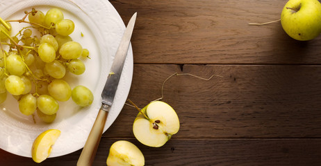 healthy Food; organic fresh juicy grape and apple on a table