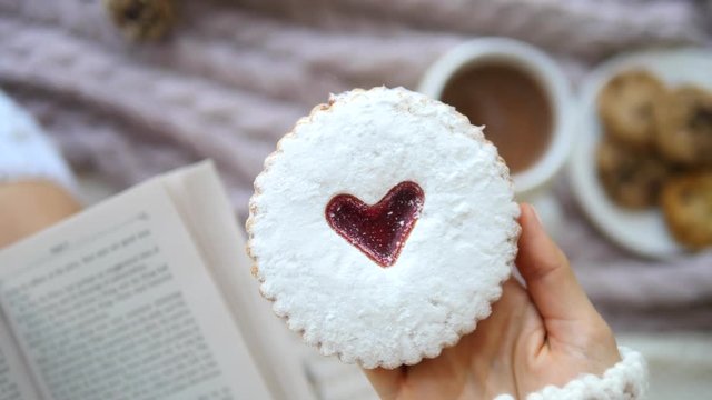 Woman Hand Holding Cookie With Heart
