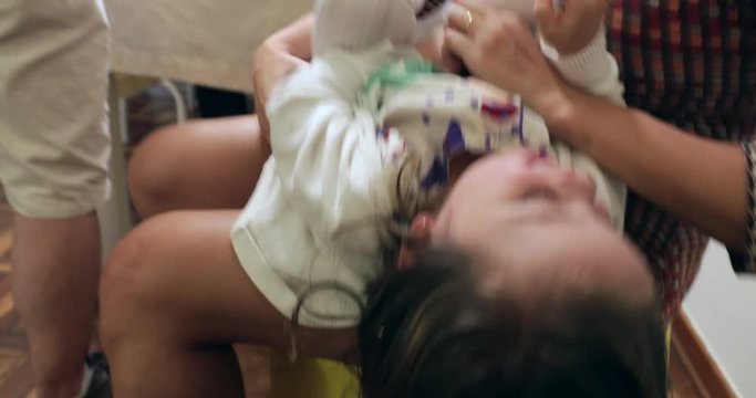 Child upside down. Little girl smiling happy to camera2