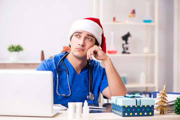 Doctor with gift box in the hospital