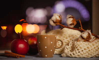 Obraz na płótnie Canvas apples, cinnamon, hot tea, warm scarf, cotton branch