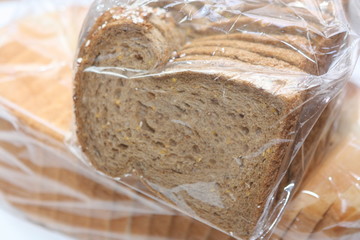 Sliced bread in plastic bag.