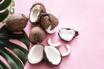 coconut halves and tropical leaves