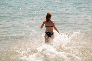  Girl runs into the sea