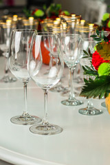 wine glasses on the table for drinks (close-up partial view). Festive crystal