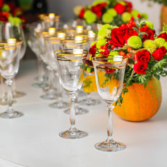 wine glasses on the table for drinks (close-up partial view). Festive crystal