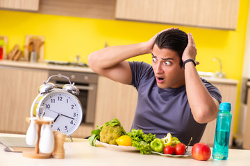 Young man in dieting and healthy eating concept