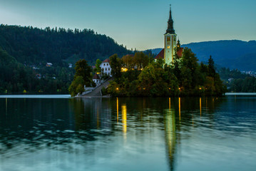 Fototapeta na wymiar Beautiful mountain lake Bled . Pilgrimage Church of the Assumption of Maria situated on an island . Mountains in background. Slovenia, Europe. European travel.